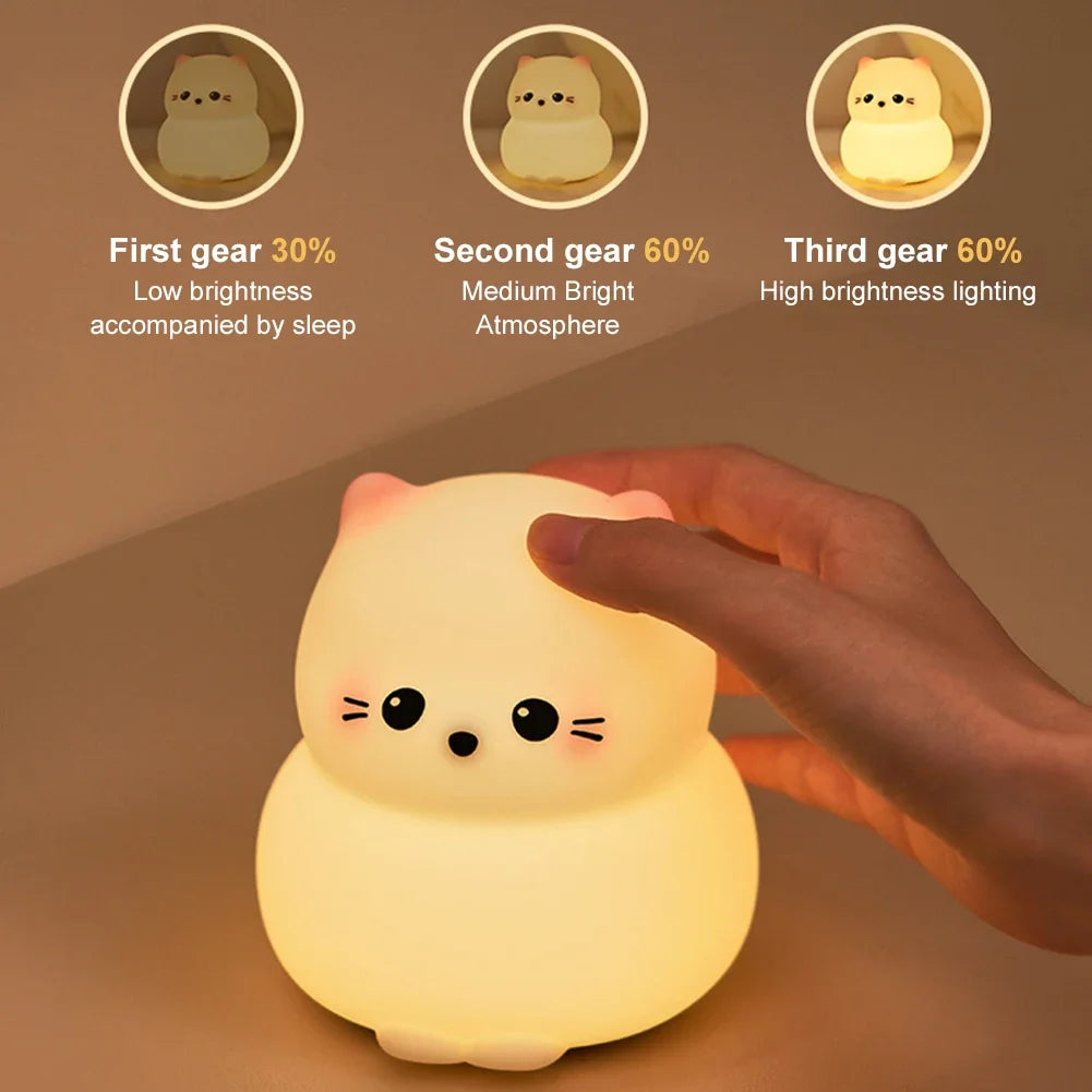 Cute cat-shaped night light with adjustable brightness settings, child’s hand touching lamp