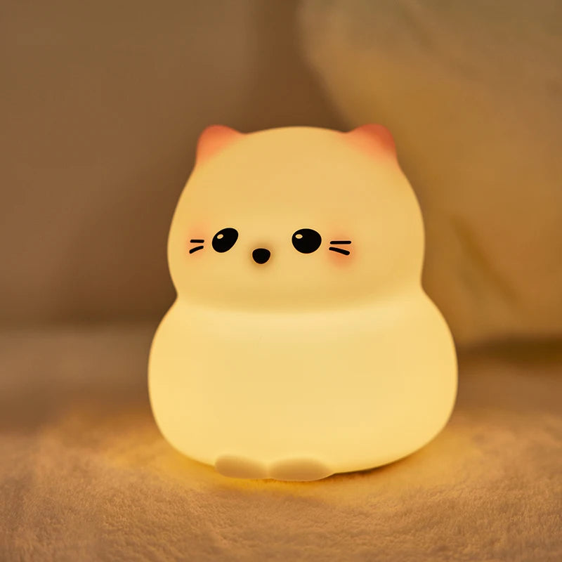 Soft-glow cat night light for children, kawaii animal lamp on cozy fabric, nursery decor